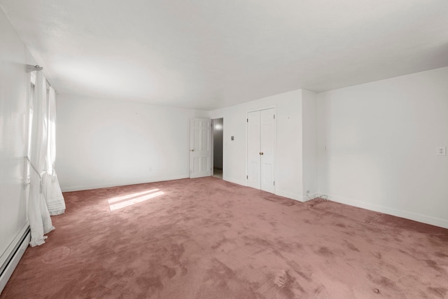 44 Weare Rd, Seabrook, NH 03874 - unfurnished bedroom with baseboard heating, carpet, and baseboards