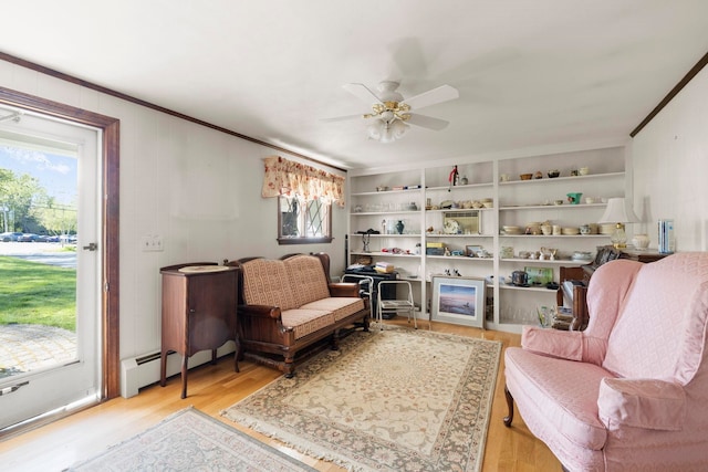 44 Weare Rd, Seabrook, NH 03874 - living area featuring light wood-style flooring, ceiling fan, ornamental molding, and baseboard heating