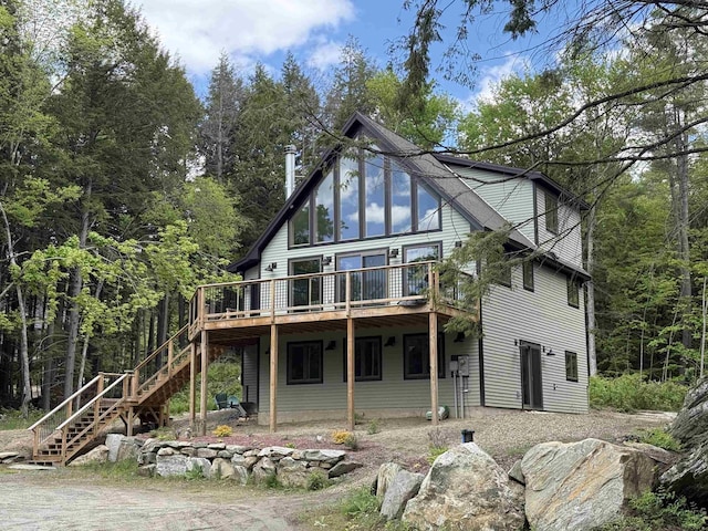 62 Highland Vws N, Ludlow, VT 05149 - rear view of house with stairs and a deck