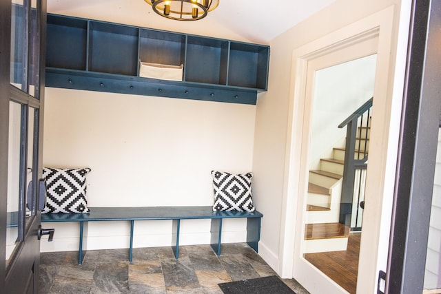62 Highland Vws N, Ludlow, VT 05149 - mudroom with stone finish floors, a chandelier, vaulted ceiling, and baseboards