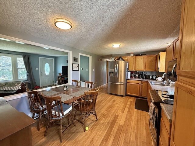50 New Haven Rd, Vergennes, VT 05491 - dining room with light wood-style flooring and a textured ceiling