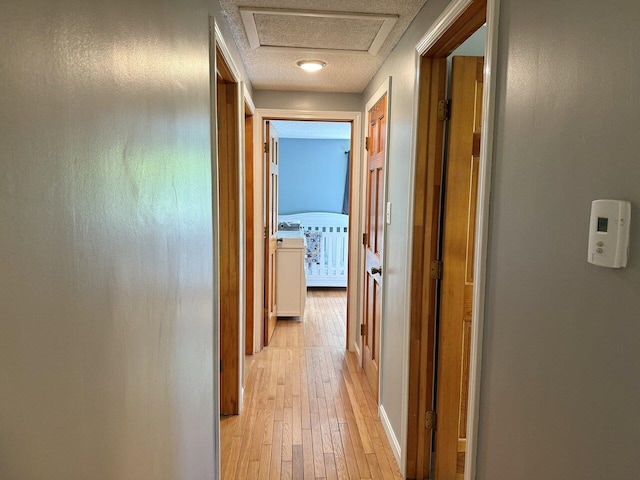 50 New Haven Rd, Vergennes, VT 05491 - hallway featuring light wood-type flooring and attic access