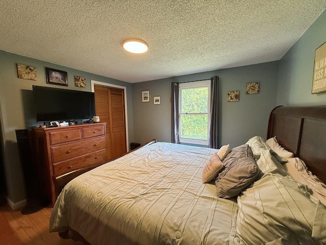50 New Haven Rd, Vergennes, VT 05491 - bedroom featuring a textured ceiling and wood finished floors