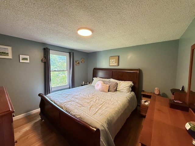 50 New Haven Rd, Vergennes, VT 05491 - bedroom with wood finished floors, baseboards, and a textured ceiling