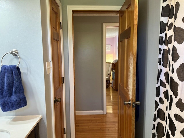 50 New Haven Rd, Vergennes, VT 05491 - full bathroom featuring wood finished floors, vanity, baseboards, and curtained shower