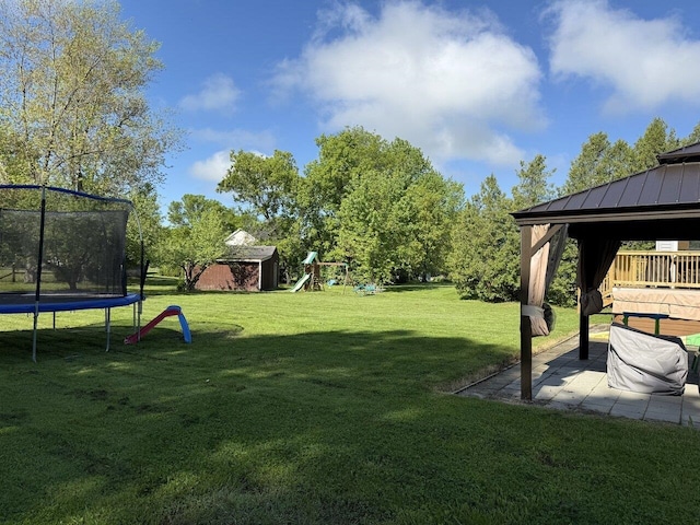 50 New Haven Rd, Vergennes, VT 05491 - view of grassy yard featuring a trampoline, a gazebo, a playground, and a patio area
