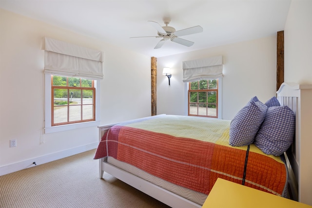 10 Wiswall Hill Rd, Newfane, VT 05345 - carpeted bedroom with multiple windows, baseboards, and a ceiling fan