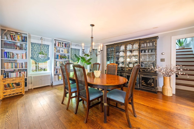 10 Wiswall Hill Rd, Newfane, VT 05345 - dining room with radiator heating unit, a chandelier, crown molding, wood finished floors, and stairs