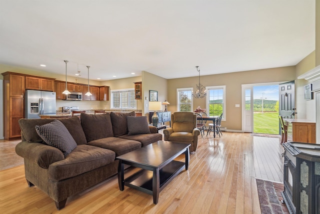 222 Park View Rd, Springfield, VT 05156 - living area with a chandelier, light wood finished floors, plenty of natural light, recessed lighting, and baseboards