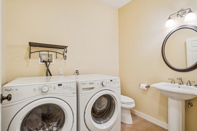 222 Park View Rd, Springfield, VT 05156 - laundry area featuring light tile patterned floors, baseboards, and washer and dryer