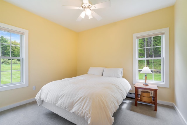 222 Park View Rd, Springfield, VT 05156 - carpeted bedroom featuring multiple windows, baseboards, and a ceiling fan