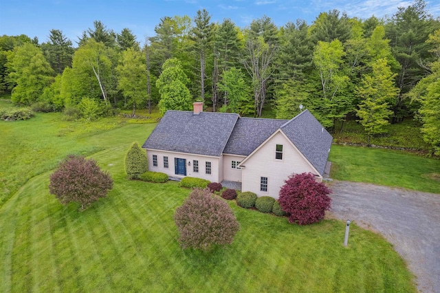 222 Park View Rd, Springfield, VT 05156 - view of front of property featuring a front yard, a chimney, a wooded view, and a shingled roof