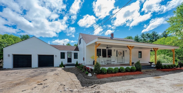 42 College Rd, Stratham, NH 03885 - view of front of house with a ceiling fan, an attached garage, a porch, a chimney, and asphalt driveway