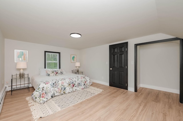 42 College Rd, Stratham, NH 03885 - bedroom with light wood-style flooring, baseboards, and vaulted ceiling
