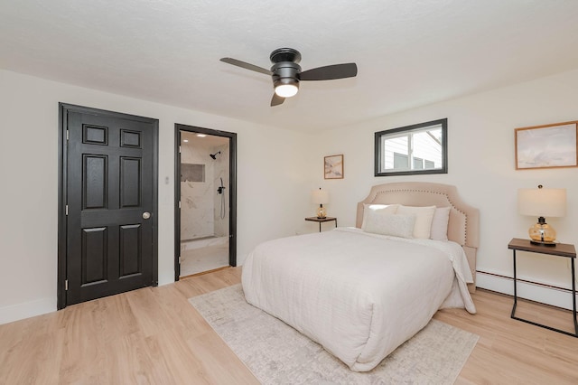 42 College Rd, Stratham, NH 03885 - bedroom featuring a baseboard radiator, light wood-type flooring, a ceiling fan, and ensuite bath