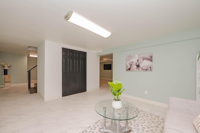 42 College Rd, Stratham, NH 03885 - living area with marble finish flooring and stairs