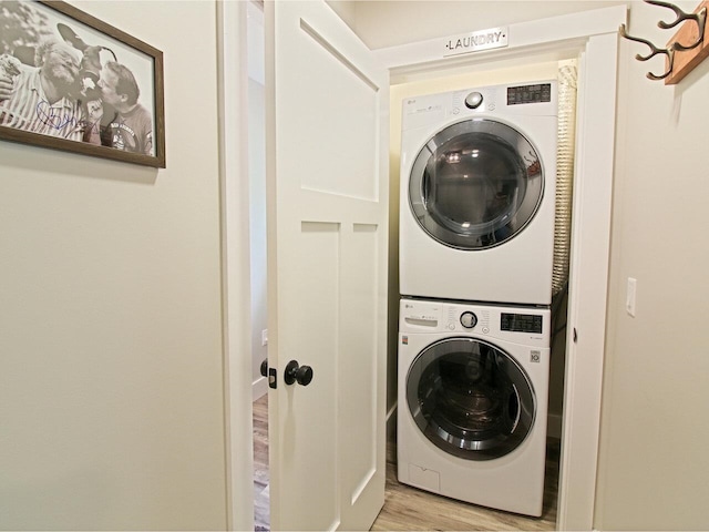 1585 Amidon Rd Unit 1, 2, 3, Montgomery, VT 05471 - laundry area featuring stacked washer / dryer and light wood finished floors