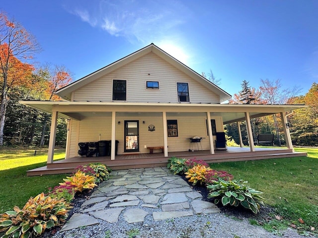 1585 Amidon Rd Unit 1, 2, 3, Montgomery, VT 05471 - back of house featuring a lawn and a porch