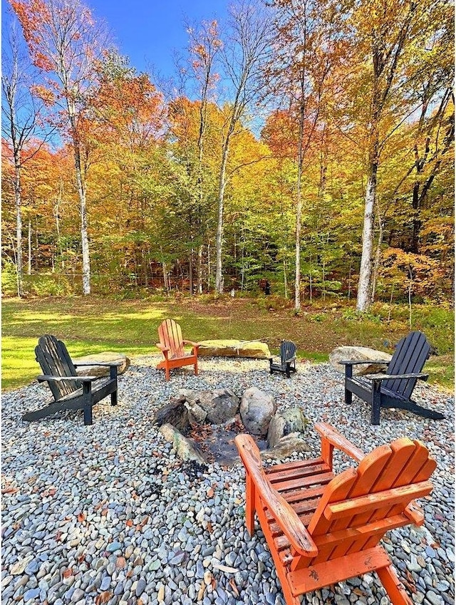 1585 Amidon Rd Unit 1, 2, 3, Montgomery, VT 05471 - view of yard with an outdoor fire pit and a forest view
