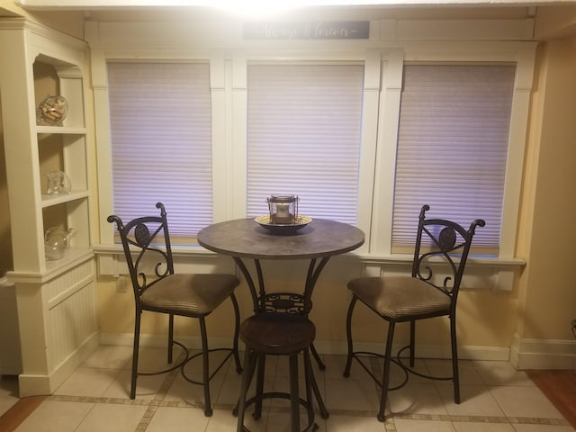 22 Chestnut St, Claremont, NH 03743 - dining room featuring light tile patterned floors and baseboards