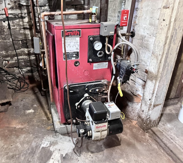 22 Chestnut St, Claremont, NH 03743 - utility room with a heating unit