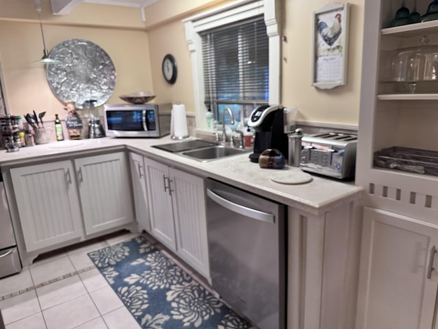 22 Chestnut St, Claremont, NH 03743 - kitchen featuring appliances with stainless steel finishes, a sink, light countertops, and light tile patterned flooring