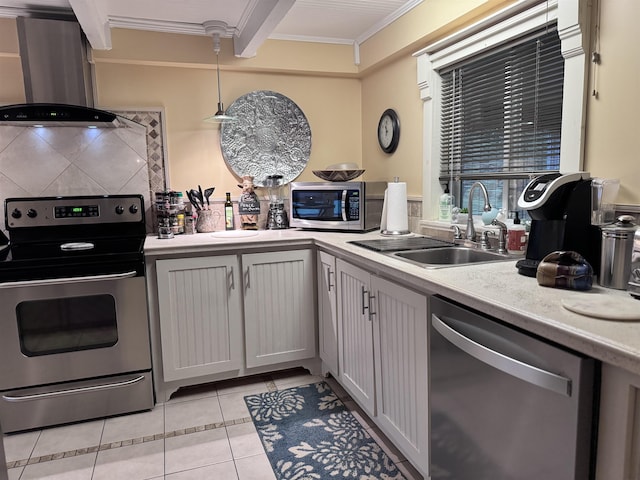 22 Chestnut St, Claremont, NH 03743 - kitchen with stainless steel appliances, ventilation hood, light countertops, ornamental molding, and light tile patterned floors