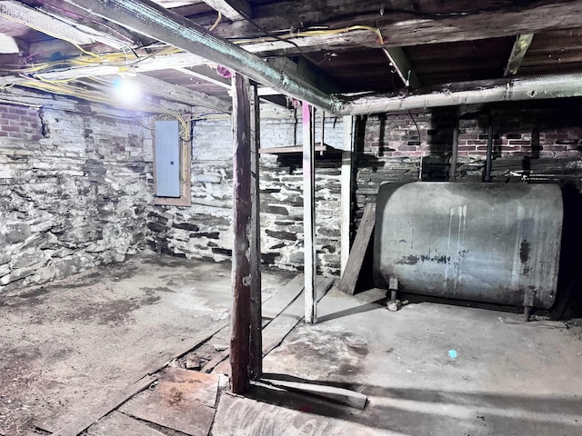 22 Chestnut St, Claremont, NH 03743 - unfinished below grade area featuring oil tank and electric panel