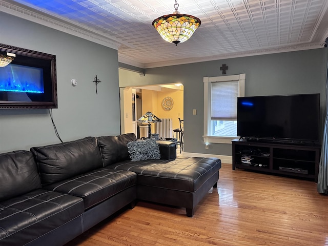 22 Chestnut St, Claremont, NH 03743 - living room with crown molding, light wood-style flooring, baseboards, and an ornate ceiling