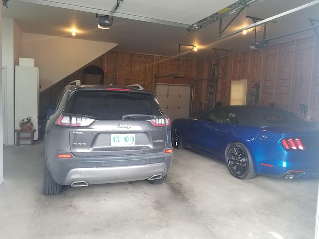 22 Chestnut St, Claremont, NH 03743 - garage with a garage door opener