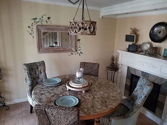 22 Chestnut St, Claremont, NH 03743 - dining space featuring ornamental molding, baseboards, tile patterned floors, and a fireplace