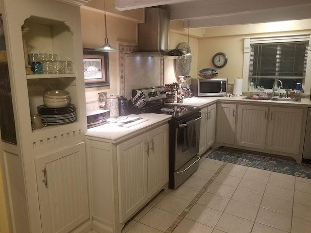 22 Chestnut St, Claremont, NH 03743 - kitchen with stainless steel appliances, island exhaust hood, a sink, light tile patterned floors, and light countertops