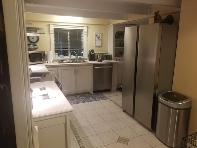 22 Chestnut St, Claremont, NH 03743 - kitchen featuring stainless steel appliances, a sink, light countertops, and light tile patterned flooring