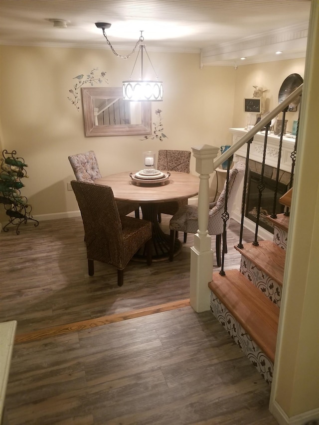 22 Chestnut St, Claremont, NH 03743 - dining room with wood finished floors, stairway, baseboards, and ornamental molding