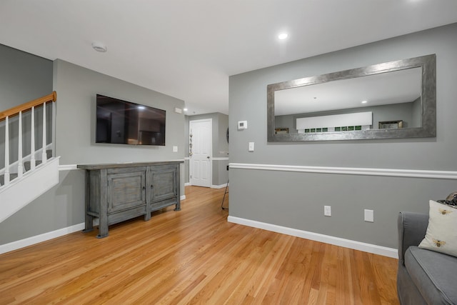 26 Eastwood Way, Manchester, NH 03109 - living area with stairway, wood finished floors, baseboards, and recessed lighting