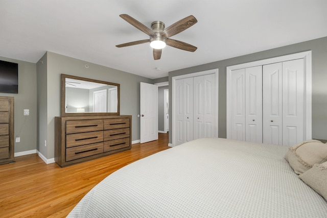 26 Eastwood Way, Manchester, NH 03109 - bedroom with light wood-style flooring, baseboards, two closets, and a ceiling fan