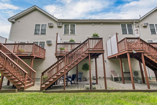 26 Eastwood Way, Manchester, NH 03109 - back of house featuring stairway, a wooden deck, and a wall unit AC