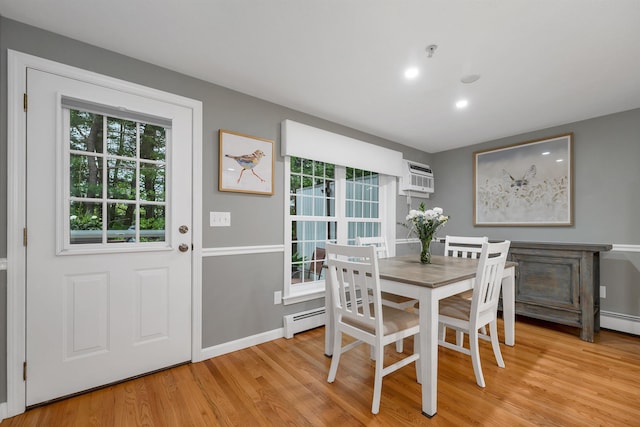 26 Eastwood Way, Manchester, NH 03109 - dining room with light wood-style flooring, a baseboard radiator, an AC wall unit, recessed lighting, and baseboards