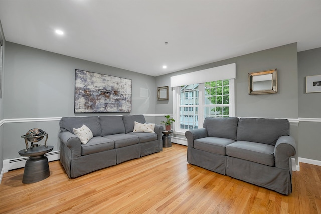 26 Eastwood Way, Manchester, NH 03109 - living room featuring wood finished floors, baseboard heating, recessed lighting, and baseboards