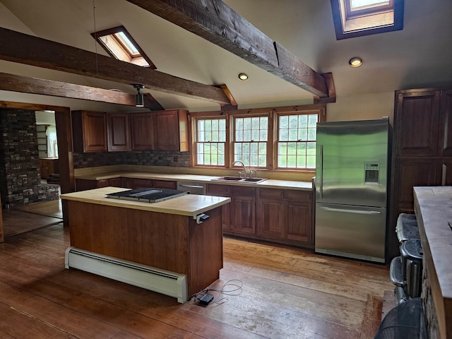 3458 Vt Route 30, Jamaica, VT 05343 - kitchen featuring stainless steel refrigerator with ice dispenser, baseboard heating, a sink, light wood-style floors, and a kitchen island