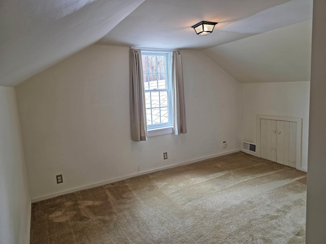 3458 Vt Route 30, Jamaica, VT 05343 - additional living space with lofted ceiling, carpet flooring, and baseboards