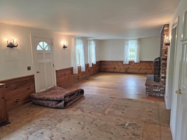 3458 Vt Route 30, Jamaica, VT 05343 - entrance foyer with a wainscoted wall, wood finished floors, and wooden walls