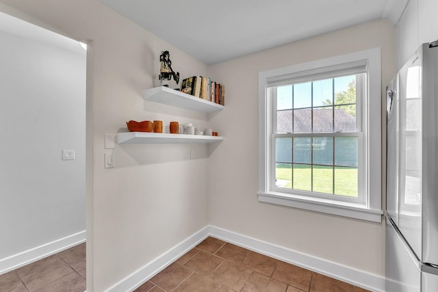 9 Conifer Ct, Burlington, VT 05401 - unfurnished dining area featuring baseboards, plenty of natural light, and tile patterned floors