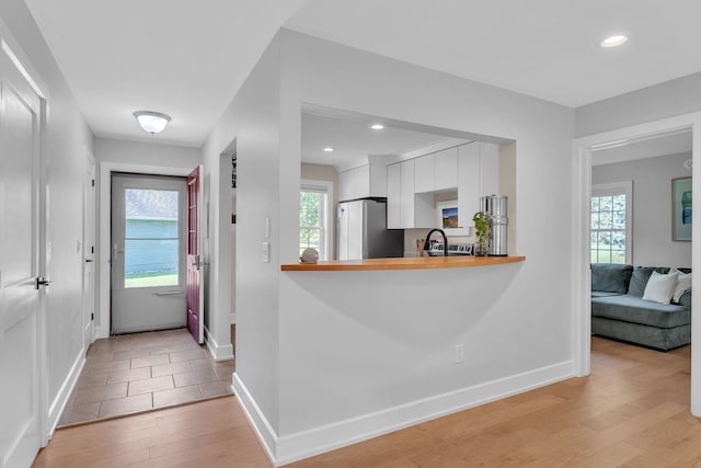 9 Conifer Ct, Burlington, VT 05401 - foyer featuring light wood finished floors, baseboards, and recessed lighting
