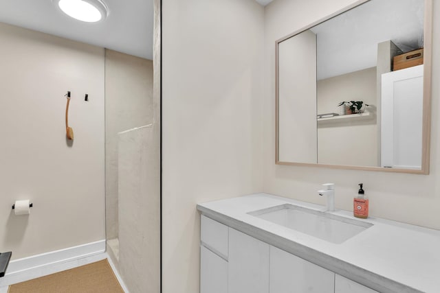 9 Conifer Ct, Burlington, VT 05401 - bathroom with vanity, a shower, and baseboards