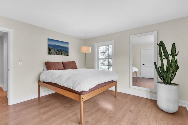 9 Conifer Ct, Burlington, VT 05401 - bedroom featuring light wood-type flooring and baseboards