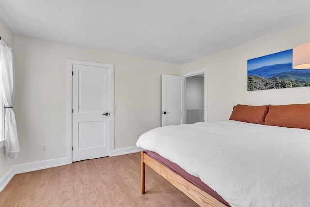 9 Conifer Ct, Burlington, VT 05401 - bedroom with light wood-type flooring and baseboards