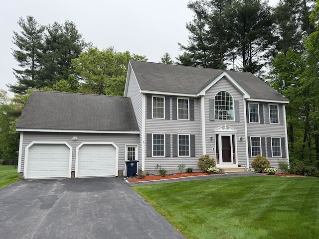 4 Sunblaze Dr, Nashua, NH 03062 - colonial inspired home with a garage, driveway, a front yard, and a shingled roof
