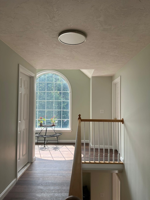 4 Sunblaze Dr, Nashua, NH 03062 - hallway with a textured ceiling, baseboards, and wood finished floors