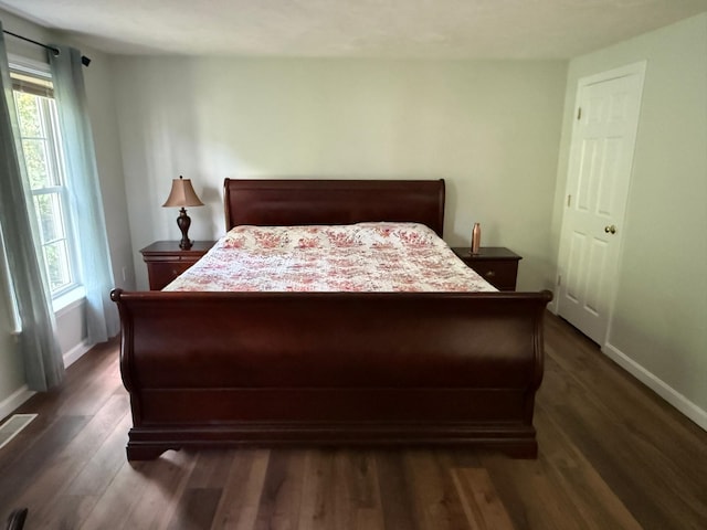 4 Sunblaze Dr, Nashua, NH 03062 - bedroom with dark wood-style floors, multiple windows, and baseboards